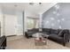The cozy living room has gray walls, carpeted floors, and a comfy sectional sofa at 829 S 111Th Dr, Avondale, AZ 85323