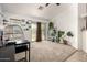 Living room featuring carpet floors, sliding glass door, and neutral colors with plants at 829 S 111Th Dr, Avondale, AZ 85323