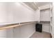 Spacious walk-in closet with built-in shelving and an antique safe at 829 S 111Th Dr, Avondale, AZ 85323