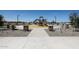 A modern community playground, framed by stone pillars and white fencing, offering a safe place for neighborhood children at 848 W Riparian Dr, San Tan Valley, AZ 85140