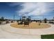 Community playground features climbing structures, slides and benches, perfect for outdoor fun in a shared space at 848 W Riparian Dr, San Tan Valley, AZ 85140