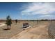 Neighborhood walking path with bench seating surrounded by desert landscaping and mountain views at 848 W Riparian Dr, San Tan Valley, AZ 85140