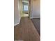 Open hallway with elegant tile flooring leading to a light-filled living area at 8582 W Rue De Lamour --, Peoria, AZ 85381
