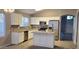 Modern kitchen with white cabinets, granite countertops, and stainless steel appliances at 8582 W Rue De Lamour --, Peoria, AZ 85381