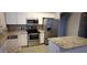 Well-equipped kitchen featuring stainless steel appliances and beautiful granite countertops at 8582 W Rue De Lamour --, Peoria, AZ 85381