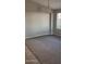 Cozy living area with soft carpeting and a large window offering natural light at 8582 W Rue De Lamour --, Peoria, AZ 85381