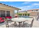 View of backyard pool and outdoor seating area with covered patio and bright blue sky at 8948 W Fargo Dr, Peoria, AZ 85382
