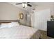 This bedroom features neutral walls, a ceiling fan, and a closet with sliding doors at 8948 W Fargo Dr, Peoria, AZ 85382