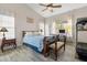 Cozy bedroom with ceiling fan, comfortable bed, and natural lighting at 8948 W Fargo Dr, Peoria, AZ 85382