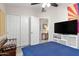 Inviting bedroom featuring a ceiling fan, large bed, and spacious closet at 8948 W Fargo Dr, Peoria, AZ 85382