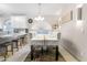An inviting dining room area with modern chandelier and table at 8948 W Fargo Dr, Peoria, AZ 85382