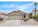 Charming single-story home featuring a two-car garage and desert landscaping at 8948 W Fargo Dr, Peoria, AZ 85382