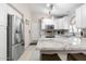 Bright kitchen featuring stainless steel appliances and white cabinetry at 8948 W Fargo Dr, Peoria, AZ 85382