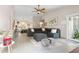 Open-concept living room with vaulted ceilings, tile floors, and ample natural light at 8948 W Fargo Dr, Peoria, AZ 85382