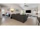 Spacious living room featuring a cozy seating area and access to the backyard at 8948 W Fargo Dr, Peoria, AZ 85382