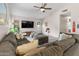 Inviting living area with a large sectional sofa and modern decor at 8948 W Fargo Dr, Peoria, AZ 85382