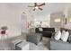 Spacious living room featuring a cozy seating area and access to the kitchen at 8948 W Fargo Dr, Peoria, AZ 85382