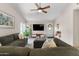 Comfortable living room featuring a ceiling fan and ample seating at 8948 W Fargo Dr, Peoria, AZ 85382