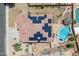 Aerial view of the home featuring solar panels, a pool, and landscaping at 13313 W Indianola Ave, Litchfield Park, AZ 85340