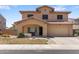Charming two-story home with a well-maintained front yard and a two car garage at 13313 W Indianola Ave, Litchfield Park, AZ 85340
