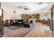 Open-concept living room connected to a well-equipped kitchen offers a comfortable and social space at 13313 W Indianola Ave, Litchfield Park, AZ 85340