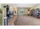 Bright living room with natural light, featuring carpet and tile flooring with a view of the entryway at 13313 W Indianola Ave, Litchfield Park, AZ 85340