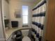 Bathroom featuring a striped shower curtain and stylish decor elements at 1426 S Havasupai Dr, Apache Junction, AZ 85119