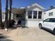 Charming single-story home with well-maintained landscaping, covered porch, and convenient driveway at 1426 S Havasupai Dr, Apache Junction, AZ 85119