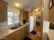 The kitchen features a practical sink, adjacent counter space and cabinetry at 1426 S Havasupai Dr, Apache Junction, AZ 85119