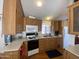 Functional kitchen layout with modern appliances, ample counter space and wood cabinets at 1426 S Havasupai Dr, Apache Junction, AZ 85119