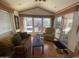 View of a well-lit living room with wood floors and comfortable furnishings at 1426 S Havasupai Dr, Apache Junction, AZ 85119