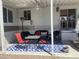 Comfortable covered patio with outdoor seating and a stylish blue patterned rug at 1426 S Havasupai Dr, Apache Junction, AZ 85119