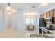 Open kitchen featuring stainless steel appliances, granite countertops, and views of the dining area at 1453 W Birch Rd, San Tan Valley, AZ 85140