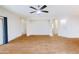 Spacious living room with wood flooring, neutral walls, and a ceiling fan at 1453 W Birch Rd, San Tan Valley, AZ 85140
