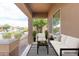 Inviting covered patio featuring a comfortable seating area with stylish outdoor furniture at 1453 W Birch Rd, San Tan Valley, AZ 85140