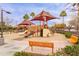 Well-maintained community playground with multiple play structures, benches and mature landscaping at 1453 W Birch Rd, San Tan Valley, AZ 85140