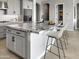 Kitchen island with granite countertop, undermount sink, pendant lighting, and shaker cabinets at 15787 W Mariposa Grande St, Surprise, AZ 85387
