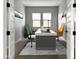 Bright office features neutral walls, wood-look tile floors, and natural lighting from the windows at 15787 W Mariposa Grande St, Surprise, AZ 85387