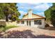 Backyard featuring a brick patio, grassy area, and lush greenery at 1601 E Cindy St, Chandler, AZ 85225