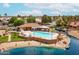 An aerial view of a community pool and clubhouse nestled on a lakefront setting with boat access at 1601 E Cindy St, Chandler, AZ 85225