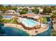 Beautiful community pool with lounge chairs, tennis court, and a scenic lake view at 1601 E Cindy St, Chandler, AZ 85225