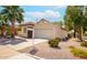 Charming home with a two-car garage, desert landscaping, and a neatly maintained front yard at 1601 E Cindy St, Chandler, AZ 85225