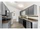 Modern kitchen with stainless steel appliances, gray cabinets, and modern countertops at 1601 E Cindy St, Chandler, AZ 85225