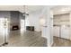 Living room with a fireplace, ceiling fan, and laundry area at 1601 E Cindy St, Chandler, AZ 85225