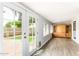 Sunroom with french doors leading to the backyard and decorative shelving at 1601 E Cindy St, Chandler, AZ 85225