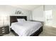 Comfortable main bedroom featuring a large bed, and a serene, neutral color scheme at 1601 E Cindy St, Chandler, AZ 85225