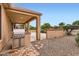 The outdoor kitchen features a built-in stainless steel grill, ideal for entertaining and outdoor dining at 17009 W Eureka Springs Dr, Surprise, AZ 85387