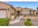 Well maintained single Gathering home featuring desert landscaping, covered entrance and updated lighting at 17009 W Eureka Springs Dr, Surprise, AZ 85387