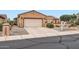 Charming single-story home featuring a two-car garage and well-maintained desert landscaping at 17009 W Eureka Springs Dr, Surprise, AZ 85387