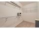 Spacious walk-in closet with metal shelving and ample storage space at 17009 W Eureka Springs Dr, Surprise, AZ 85387